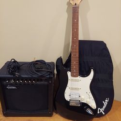 starcaster by Fender with amplifier 