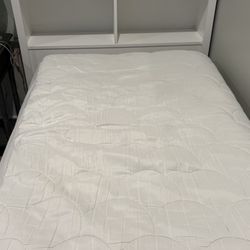 White Twin Bed with Built-In Bookshelf Headboard