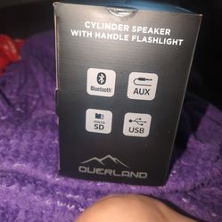 Cylinder speaker with handle flashlight