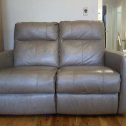 Taupe leather reclining loveseat sofa for two