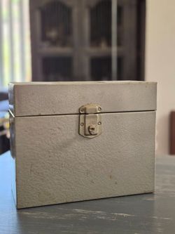 Vintage metal storage box with key