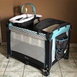 PRACTICALLY NEW INGENUITY BABY PLAY PEN/ PACK AND PLAY WITH CHANGING TABLE!!!!!