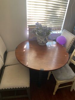 Round dining table with chairs