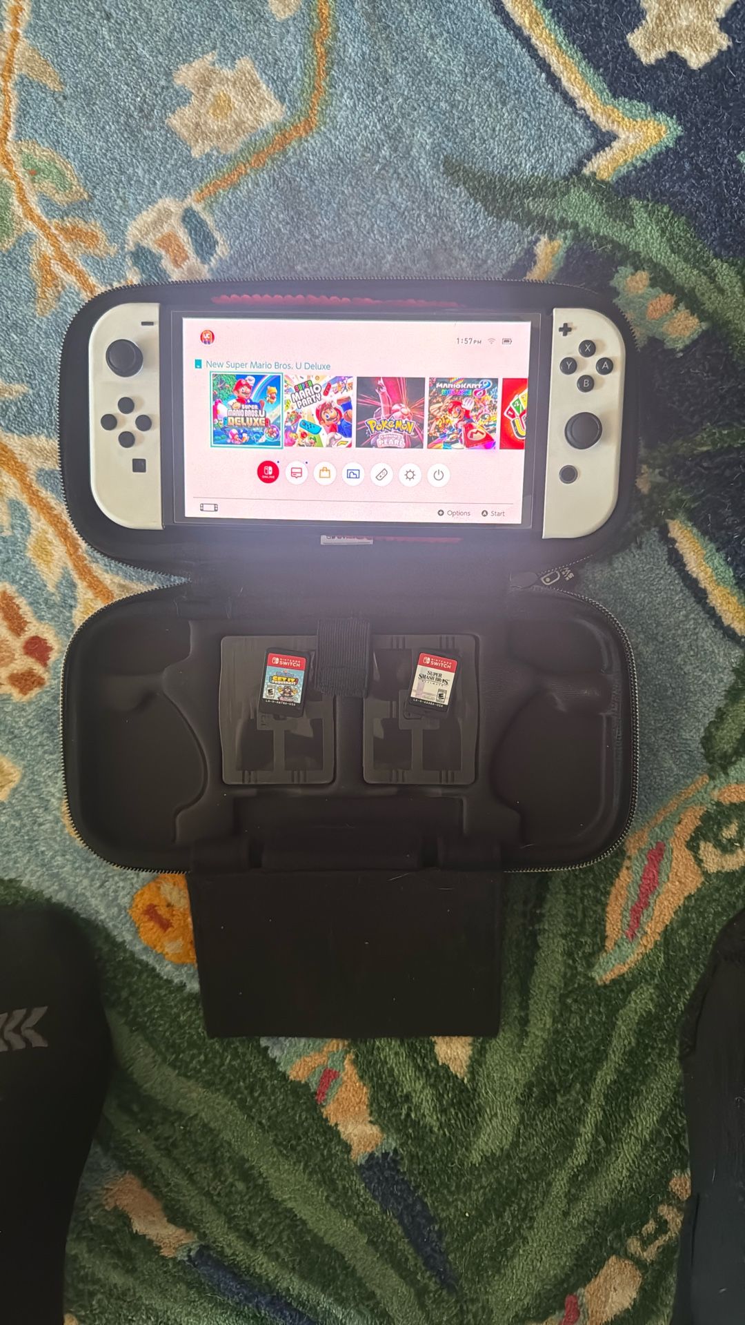 Nintendo Switch OLED with games, controllers, cases, memory card