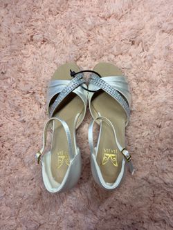 Silver satin heels with rhinestone straps and gold buckle detail