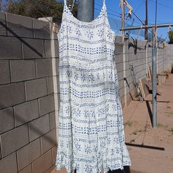 A bunch of different dresses for women