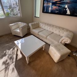 White sofa with two children on table