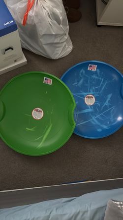 2 plastic saucer snow sleds