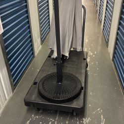Outdoor umbrella, solar powered lights inside the umbrella