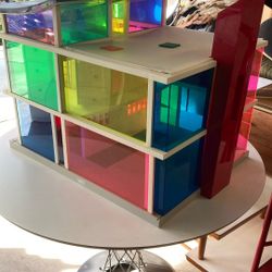 1970s dollhouse created by an architect sliding doors different color panels. No furniture included condition is about an eight.