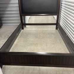 Queen size walnut headboard, footboard, wooden rails, and support rack