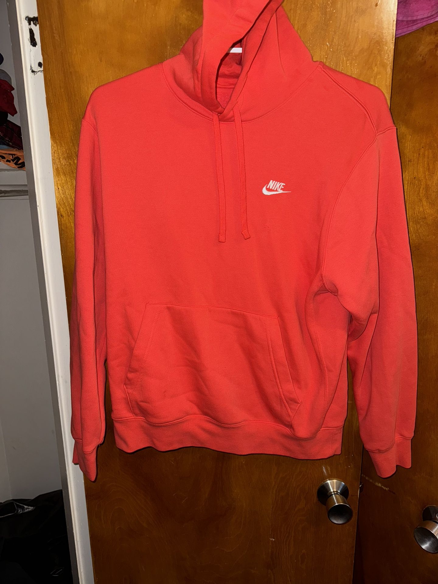 Men’s size, a large red Nike Hoodie 