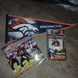 The Denver Broncos Tim Tebow #15 figurine w/ FREE '12 calendar & pennant.