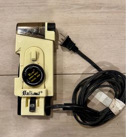 A vintage Valiant Spray Mist Travel Iron