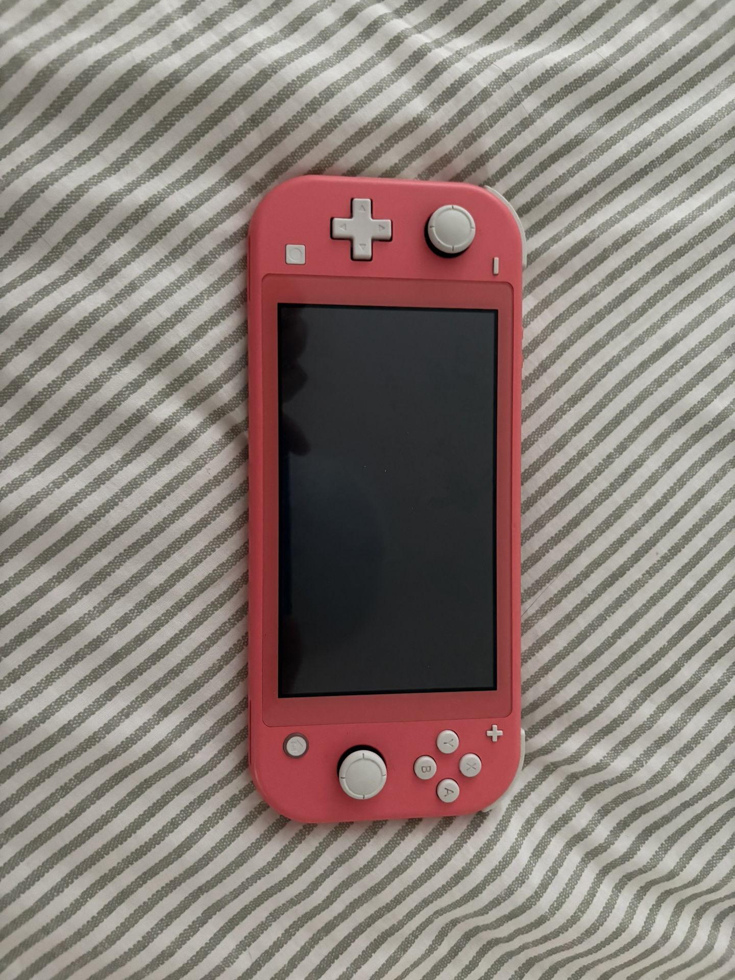 Nintendo Switch Lite (Coral color way)