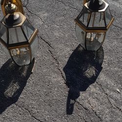 Two 25 in brass lamps with beveled glass we're outside door for your porch