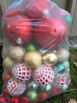Large bag of Christmas ornaments red green gold