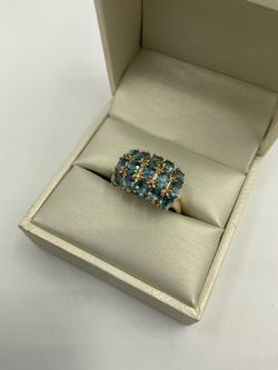 MOTHER’S DAY SPECIAL 10KT YELLOW GOLD RING WITH 3 ROWS OF BLUE STONES 4.1GR SIZE 9.75