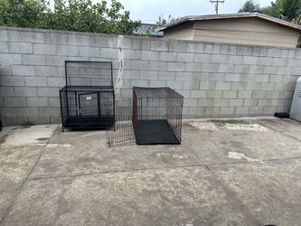 Two Black Metal Dog Crates