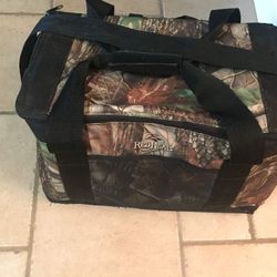 Redhead Bass Pro Camo Cooler 48 can. Measures 16”x10”x12” deep
