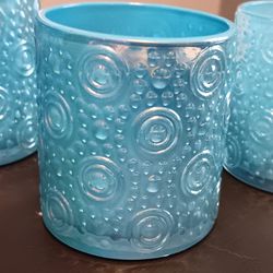 Set Of 4 Blue Irradesent Candle Holders 3"Tall x 2.75"Wide.