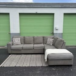 Free Delivery - Grey Sectional With Chase 
