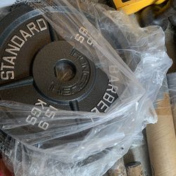 Very nice looking Brand new 45 and 35 lb Olympic weight plates.  Pair of 45s =$110 Pairs of 35s=$90