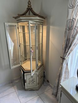 Lighted Oriental Octagonal Display Cabinet With Glass Shelves And Storage On The Bottom