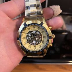 Unraion Analog Quartz men’s carved skeleton luxury stainless steel watch water resistant. Gold