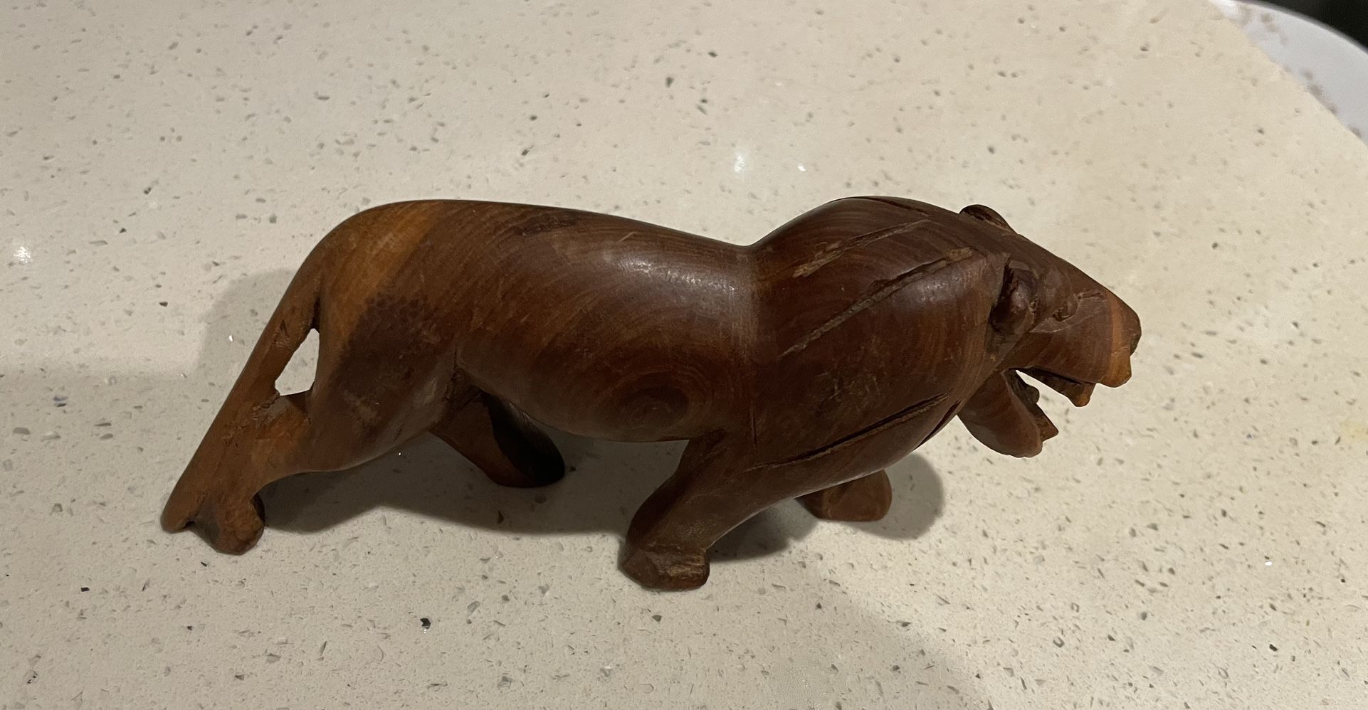 7 inch long wood carve Lion