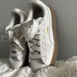 Puma Fenty Creeper sneakers in white/cream with gum sole and gold accents.