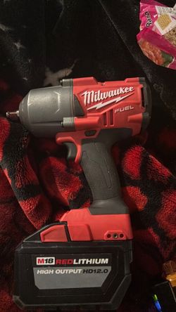 Milwaukee fuel brushless  1/2 “ square ring impact wrench 18v also have a M18 red lithium high output hd12.0 battery and the battery charger