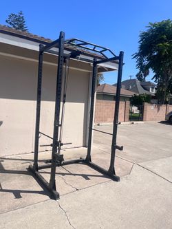 Squat rack with pulley system for weights