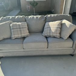 Gray sofa With 4 Pillows