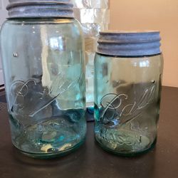 Set of 2 antique Ball slope shoulder Mason jars with zinc milk-glass lined lids (quart and pint) both have bubbles which increase their value because 