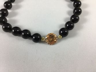 New 7 3/4” Elegant Black Crystal Pearl Bead Bracelet Crystal black pearls are made by Swarovski with Champagne Cubic Zirconia (CZ) Center Stone with