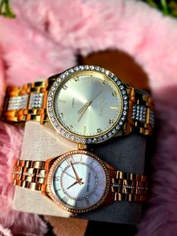 Men's and women's gold watches