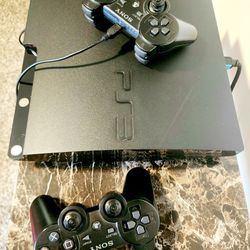 Orginal PS3 With Two Controllers & Games