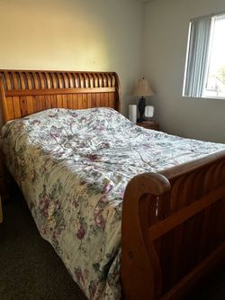 Wooden bed with the mattress