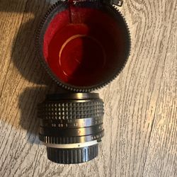 50 Mm Minolta Camera Lens And Electroflash 