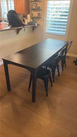 Long black table and chairs
