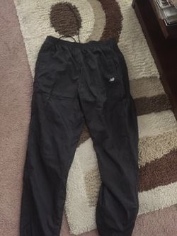 L. New Balance running weather proof pants. New w/o tags. You need it. I don’t. Come get it