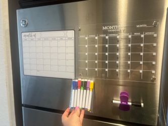 Two magnetic calendars with markers