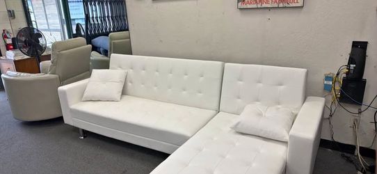 New White or Black Leather Sectional Sleeper.  99x62x34H; 72x70x23H.  Free Delivery!