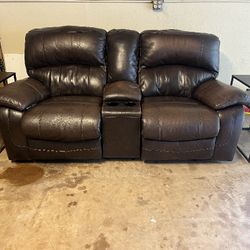 twin reclining leather armchairs, with 2 side tables
