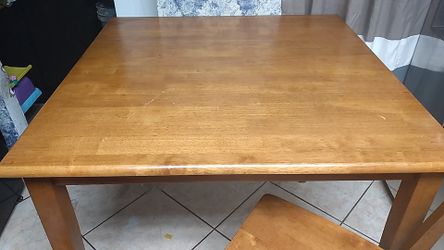 High dining table with four stools