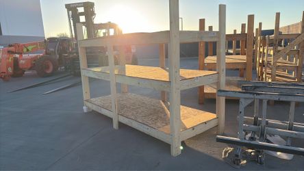 Heavy duty wood shelf built out of two by sixes and plywood