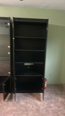 2 black Shelving Units