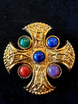 $30. Vintage Scottish Celtic Shield gold tone Brooch with 5 faux gemstones in blue, purple, red, and green. Marked Soldor.