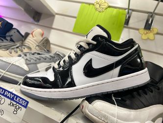 Shiny black-and-white Nike shoes